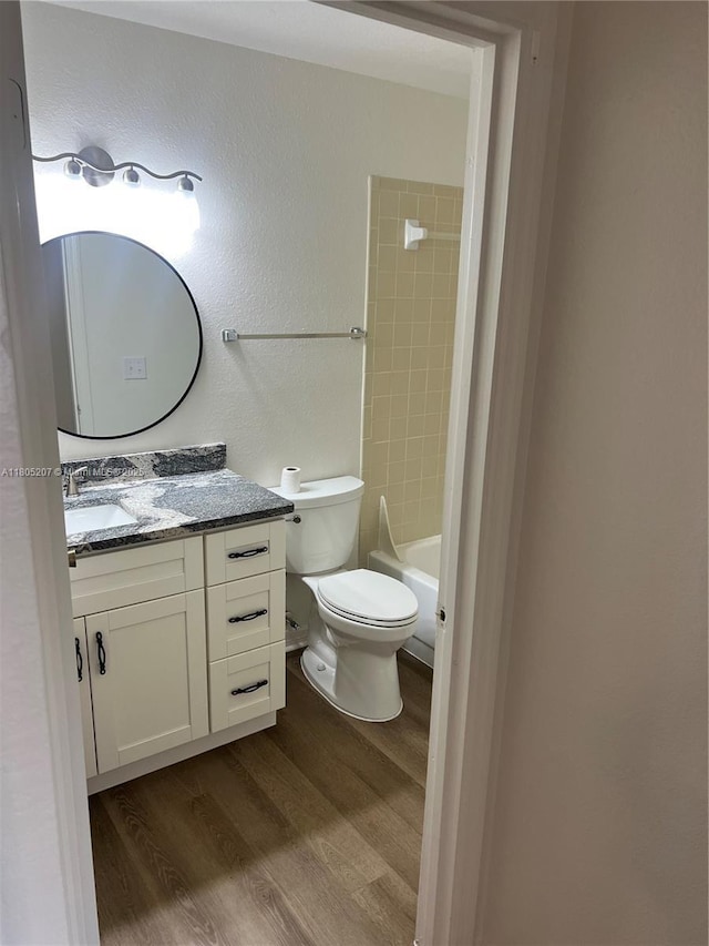 1055 S Hiawassee Rd Unit 2014, Orlando, FL 32835 - full bathroom with wood finished floors, vanity, toilet, and tub / shower combination