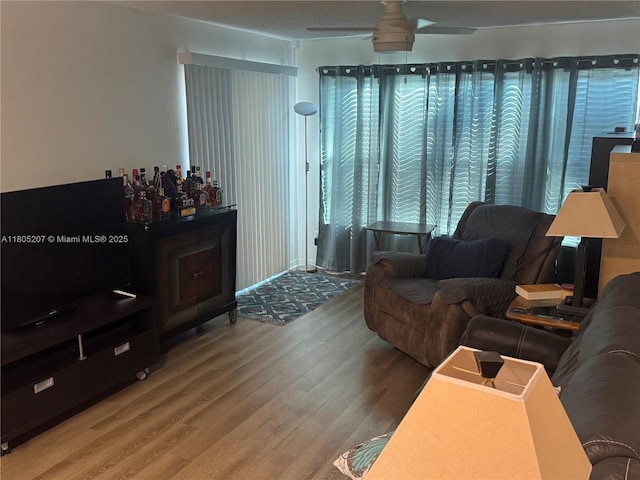 1055 S Hiawassee Rd Unit 2014, Orlando, FL 32835 - living area with wood finished floors and ceiling fan
