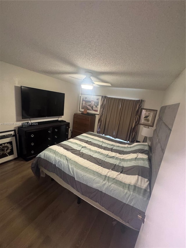 1055 S Hiawassee Rd Unit 2014, Orlando, FL 32835 - bedroom featuring wood finished floors, a textured ceiling, and a ceiling fan