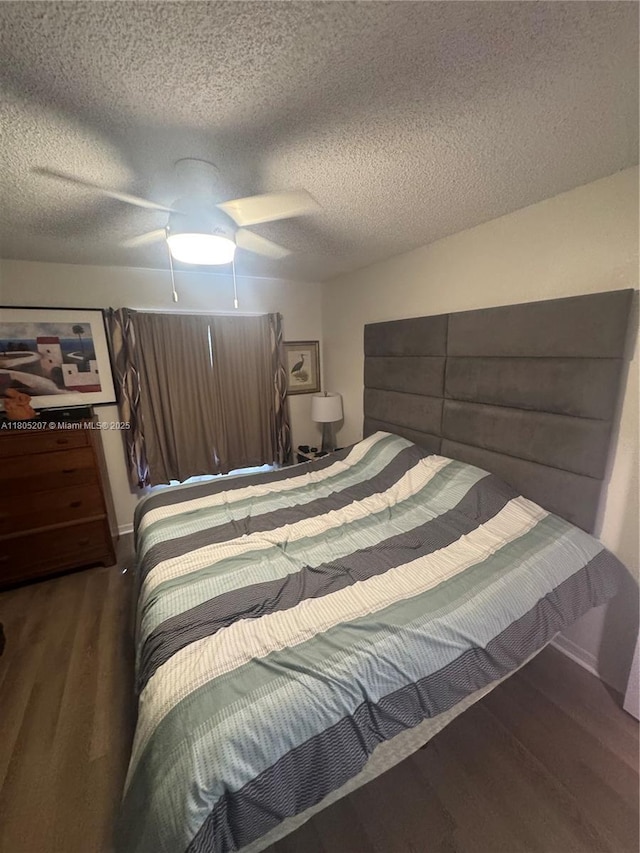 1055 S Hiawassee Rd Unit 2014, Orlando, FL 32835 - bedroom with wood finished floors, a textured ceiling, and a ceiling fan