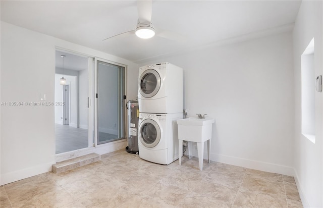 919 NW 13th St, Fort Lauderdale, FL 33311 - laundry room with stacked washer / drying machine, ceiling fan, baseboards, and water heater