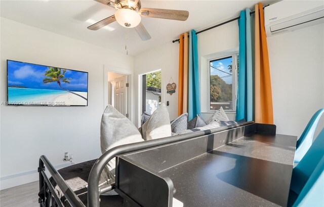 919 NW 13th St, Fort Lauderdale, FL 33311 - office featuring a wall unit AC, a ceiling fan, and wood finished floors