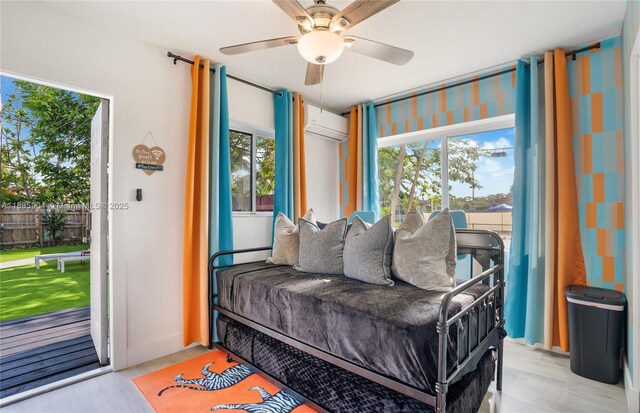 919 NW 13th St, Fort Lauderdale, FL 33311 - sitting room with a wall mounted air conditioner, a ceiling fan, and wood finished floors