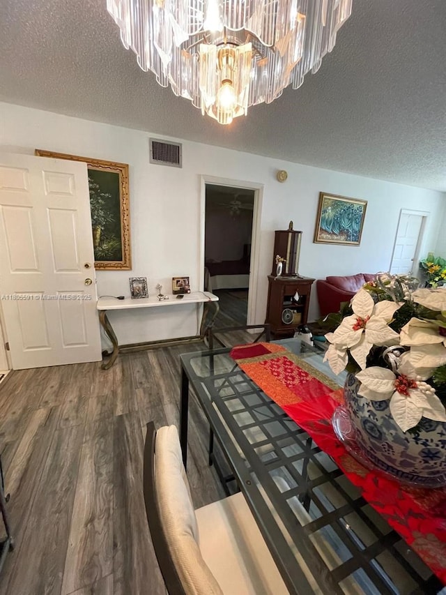 7400 NW 17th St Unit 209, Plantation, FL 33313 - living room with a chandelier, a textured ceiling, and wood finished floors