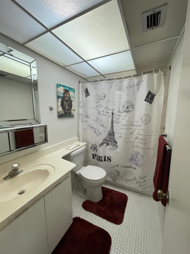 7400 NW 17th St Unit 209, Plantation, FL 33313 - bathroom featuring vanity, a paneled ceiling, toilet, a shower with shower curtain, and tile patterned floors