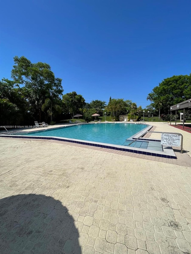 7400 NW 17th St Unit 209, Plantation, FL 33313 - community pool with a patio area