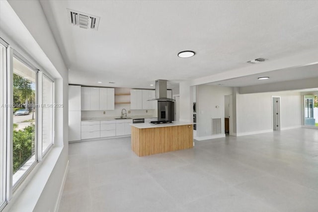 1459 Jefferson St, Hollywood, FL 33020 - kitchen with modern cabinets, a sink, wall chimney exhaust hood, a center island, and open floor plan