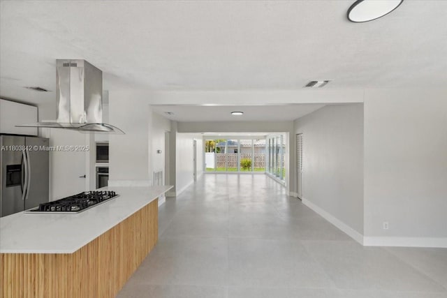 1459 Jefferson St, Hollywood, FL 33020 - kitchen with island exhaust hood, appliances with stainless steel finishes, baseboards, modern cabinets, and open floor plan