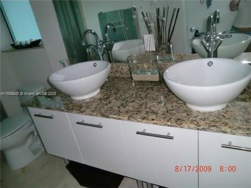 41 SE 5th St Unit 2317, Miami, FL 33131 - bathroom featuring vanity and toilet