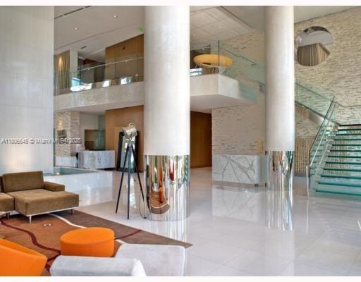 41 SE 5th St Unit 2317, Miami, FL 33131 - community lobby featuring a high ceiling and stairway