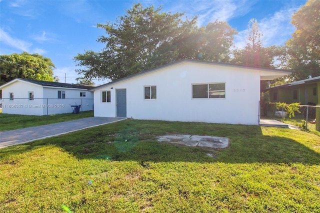 5510 NW 30th Ave, Miami, FL 33142 - rear view of house with stucco siding