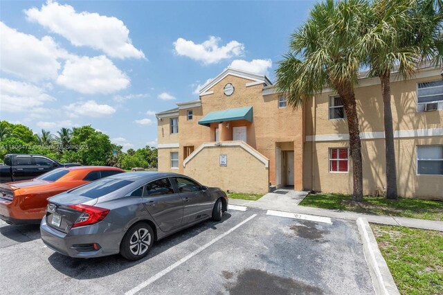 2401 NW 56th Ave Unit 3-202, Lauderhill, FL 33313 - view of property with uncovered parking