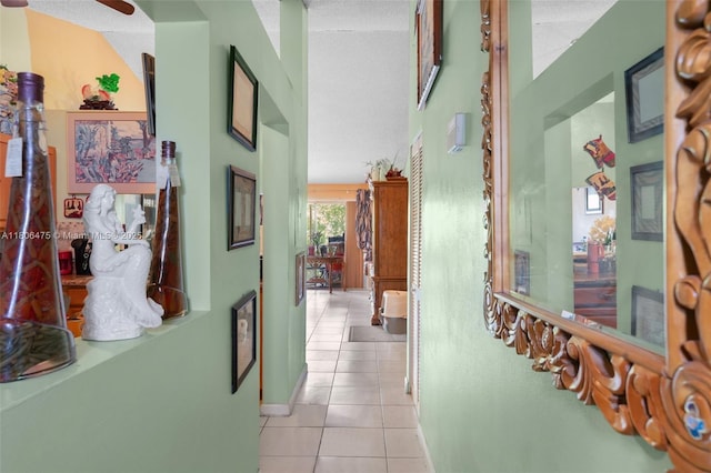 2401 NW 56th Ave Unit 3-202, Lauderhill, FL 33313 - hall with light tile patterned flooring and baseboards