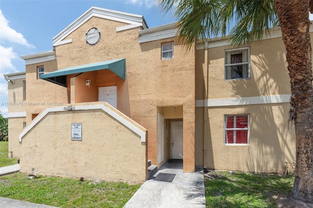 2401 NW 56th Ave Unit 3-202, Lauderhill, FL 33313 - view of front of property with stucco siding