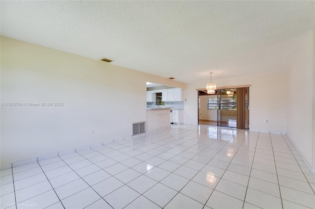 3521 SW 105th Ct, Miami, FL 33165 - unfurnished living room with light tile patterned floors, a textured ceiling, and a chandelier