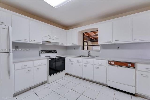 3521 SW 105th Ct, Miami, FL 33165 - kitchen featuring white appliances, under cabinet range hood, a sink, and light countertops