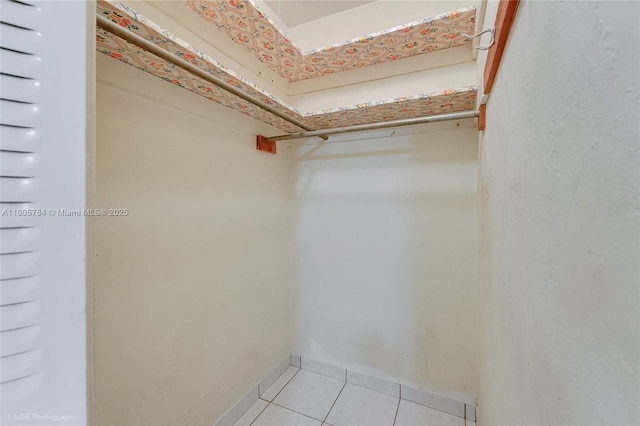 3521 SW 105th Ct, Miami, FL 33165 - spacious closet featuring light tile patterned floors