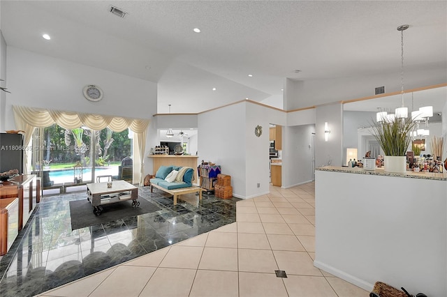 5362 NW 108th Way, Coral Springs, FL 33076 - living room featuring a chandelier, lofted ceiling, recessed lighting, baseboards, and light tile patterned floors