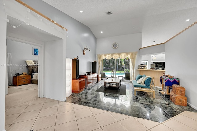 5362 NW 108th Way, Coral Springs, FL 33076 - living room featuring high vaulted ceiling, recessed lighting, tile patterned floors, a textured ceiling, and baseboards