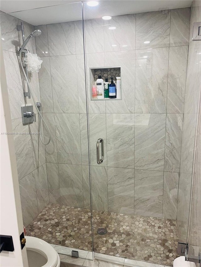 7736 Lakeside Blvd Unit G205, Boca Raton, FL 33434 - bathroom featuring a shower stall and toilet