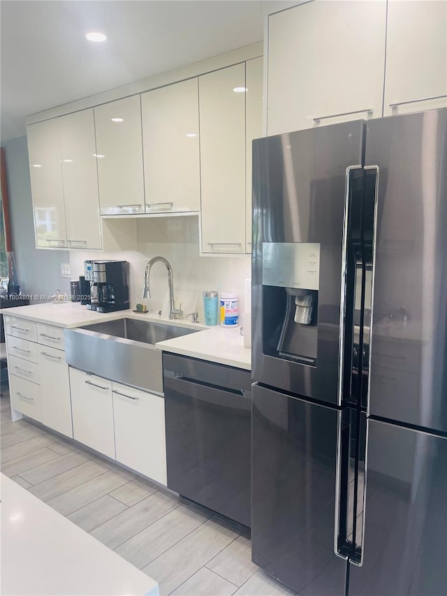 7736 Lakeside Blvd Unit G205, Boca Raton, FL 33434 - kitchen with stainless steel fridge with ice dispenser, a sink, dishwashing machine, light countertops, and white cabinets