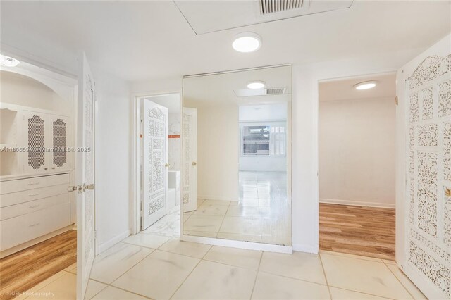 5255 Collins Ave Unit 14D, Miami Beach, FL 33140 - corridor featuring tile patterned flooring and baseboards