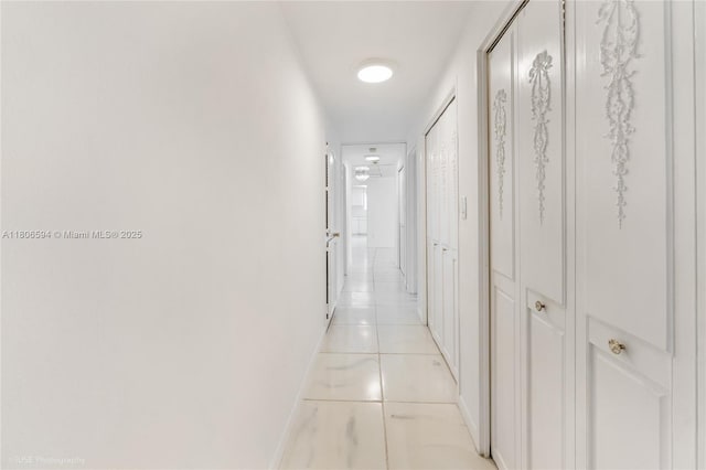 5255 Collins Ave Unit 14D, Miami Beach, FL 33140 - corridor with baseboards and light tile patterned flooring