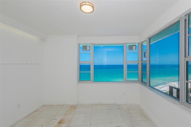 5255 Collins Ave Unit 14D, Miami Beach, FL 33140 - empty room with marble finish floors and baseboards