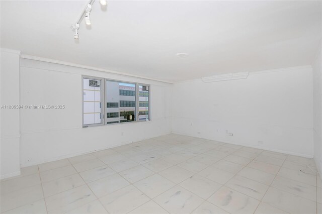 5255 Collins Ave Unit 14D, Miami Beach, FL 33140 - spare room with ornamental molding