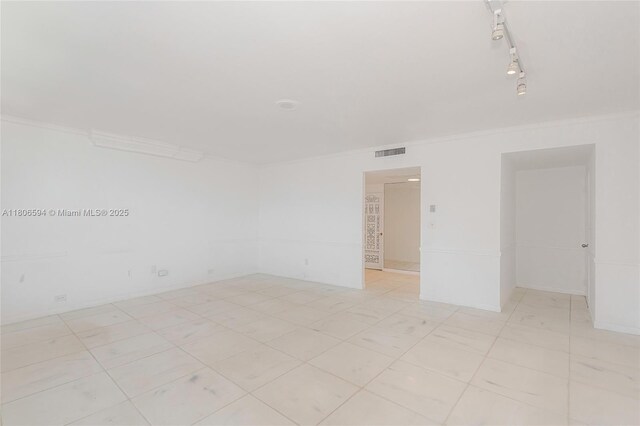 5255 Collins Ave Unit 14D, Miami Beach, FL 33140 - empty room with crown molding and rail lighting