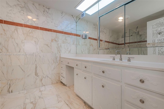 5255 Collins Ave Unit 14D, Miami Beach, FL 33140 - bathroom featuring tile walls, vanity, a marble finish shower, and marble finish floors