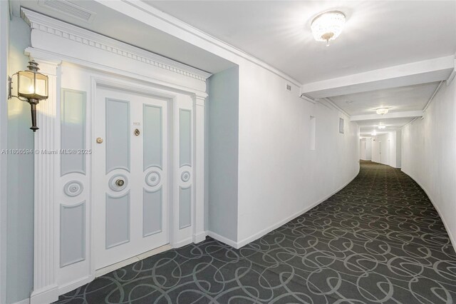 5255 Collins Ave Unit 14D, Miami Beach, FL 33140 - corridor featuring dark carpet and baseboards