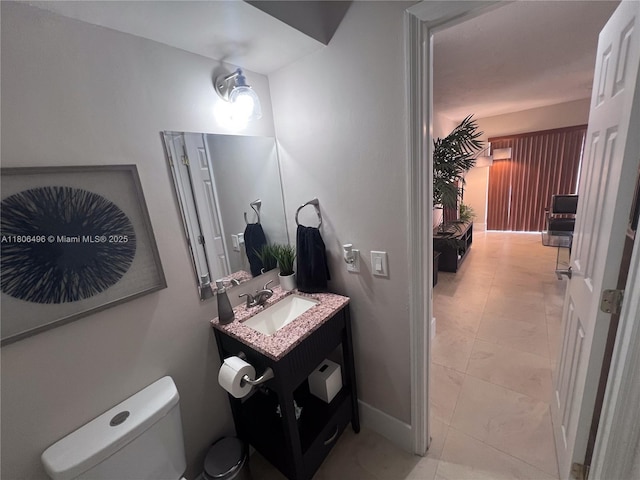 bathroom with toilet and vanity