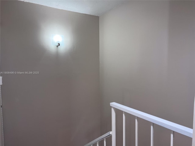 hall featuring an upstairs landing