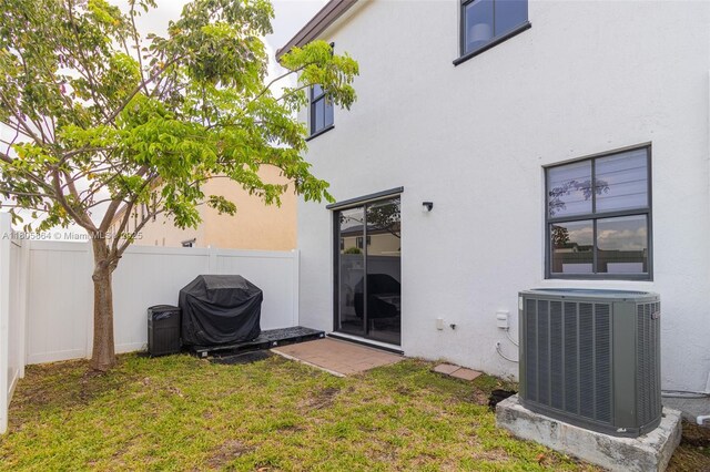 10966 W 33rd Way, Hialeah, FL 33018 - rear view of house featuring central AC unit and stucco siding