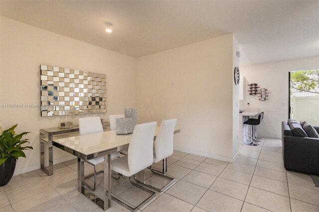 10966 W 33rd Way, Hialeah, FL 33018 - dining space featuring light tile patterned floors and baseboards