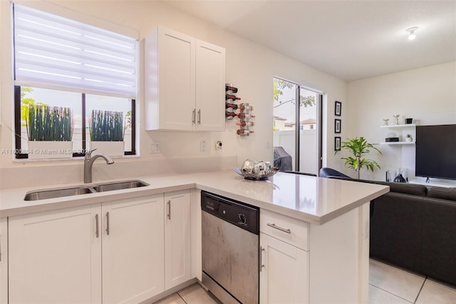 10966 W 33rd Way, Hialeah, FL 33018 - kitchen featuring dishwasher, a sink, open floor plan, light tile patterned floors, and white cabinetry