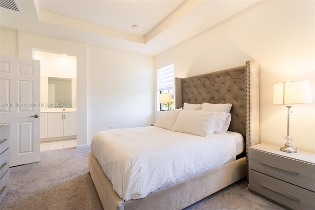 10966 W 33rd Way, Hialeah, FL 33018 - bedroom featuring carpet floors, ensuite bathroom, and a tray ceiling