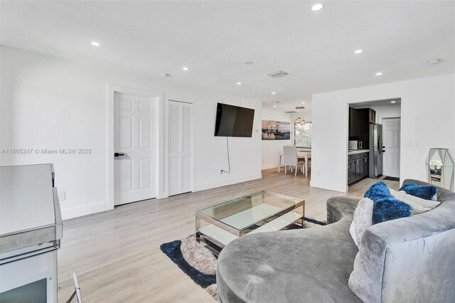 4029 SW 22nd St, West Park, FL 33023 - sitting room with wood finished floors, recessed lighting, and a textured ceiling