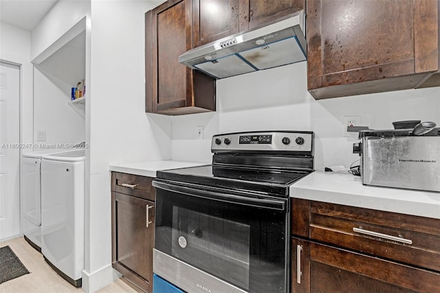 4029 SW 22nd St, West Park, FL 33023 - kitchen with electric stove, washing machine and clothes dryer, ventilation hood, and dark brown cabinets