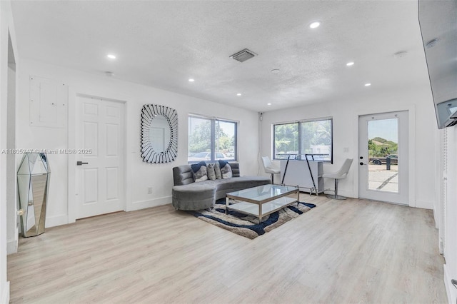4029 SW 22nd St, West Park, FL 33023 - living area with light wood-style flooring, recessed lighting, a textured ceiling, and electric panel