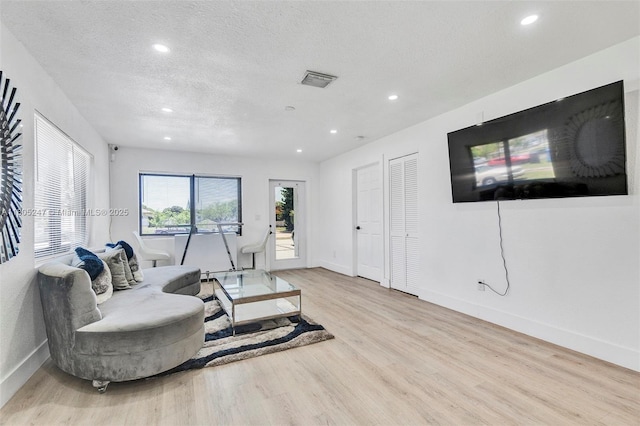 4029 SW 22nd St, West Park, FL 33023 - living area featuring wood finished floors, recessed lighting, baseboards, and a textured ceiling