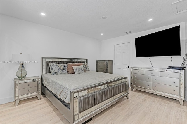4029 SW 22nd St, West Park, FL 33023 - bedroom featuring light wood finished floors, recessed lighting, and a textured ceiling
