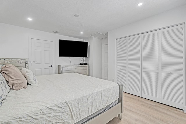 4029 SW 22nd St, West Park, FL 33023 - bedroom featuring light wood-style flooring, recessed lighting, a closet, and a textured ceiling
