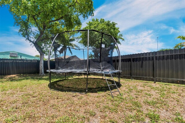 4029 SW 22nd St, West Park, FL 33023 - fenced backyard featuring a trampoline