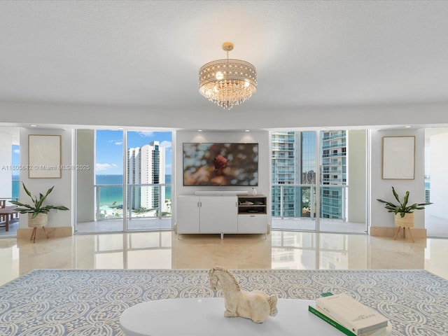 200 Sunny Isles Blvd Unit 2-Uph3, Sunny Isles Beach, FL 33160 - tiled dining room featuring a chandelier, plenty of natural light, and a textured ceiling