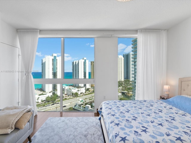 200 Sunny Isles Blvd Unit 2-Uph3, Sunny Isles Beach, FL 33160 - bedroom with a city view, a water view, multiple windows, and wood finished floors