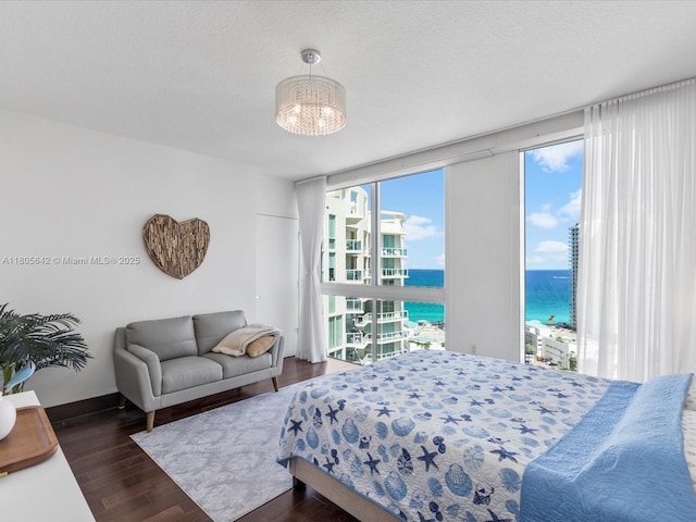 200 Sunny Isles Blvd Unit 2-Uph3, Sunny Isles Beach, FL 33160 - bedroom featuring a water view, wood finished floors, and a chandelier