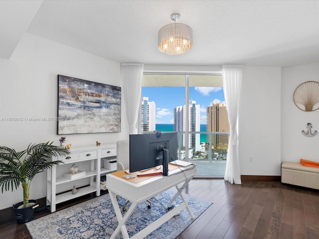 200 Sunny Isles Blvd Unit 2-Uph3, Sunny Isles Beach, FL 33160 - office area featuring a chandelier, wood finished floors, baseboards, a textured ceiling, and expansive windows