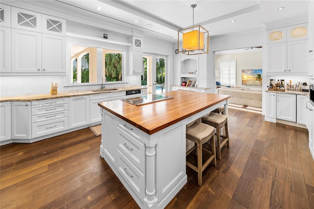 7120 Mira Flores Ave, Coral Gables, FL 33143 - kitchen featuring wood counters, a sink, white cabinets, decorative backsplash, and dark wood finished floors